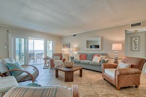 Open living room with large screen TV