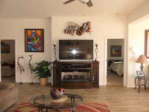 Living room with entrance to master bedroom