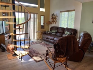 Main living area with sliding door to porch swing.