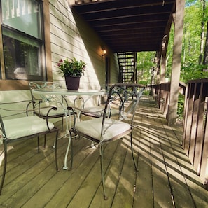 Private outdoor dining for 4 (plus bench seating) overlooking streams.