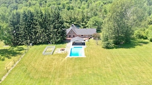 Backyard is fenced but the pool itself is not. Expansive green views