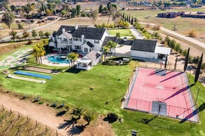 [Resort Property] Aerial view with the vineyard and tennis court