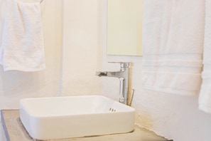 Detail of the bathroom. The sinks and taps are new.