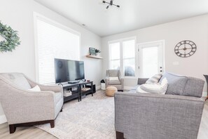 Living Room with comfortable seating and 55" TV