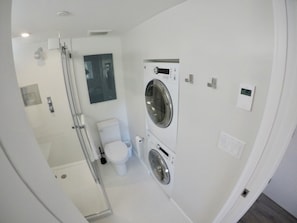 Ensuite with washer/dryer, 1 piece toilet, heated floors.