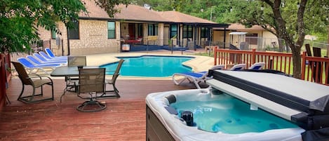 Enjoy the hot tub and swimming pool with family and friends.