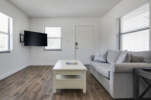 Cozy living room with sofa bed and Smart TV.