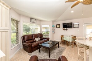 Spacious open LR, DR, and kitchen concept. Enjoy the Fl sky thru the bay window.
