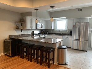Chef's Kitchen, First Floor (half bath and back patio access not pictured)