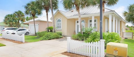 Beautifully landscaped and a white picket fence