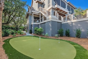 Enjoy a little backyard golf on the putting green!