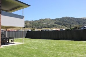 Very big and completely fenced off backyard where the kids can play