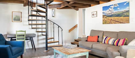 Living room with spiral staircase