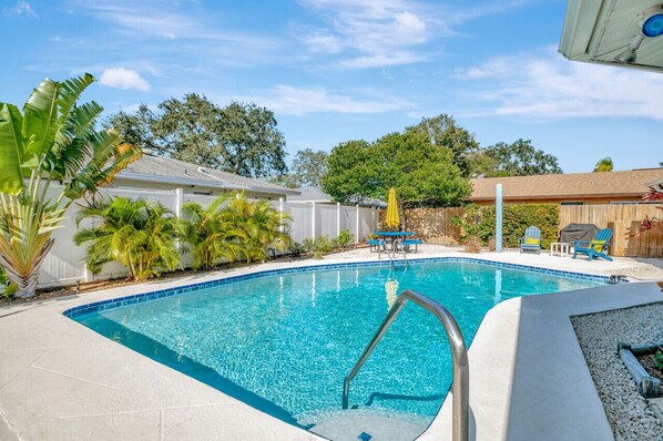 The large heated swimming pool is professionally serviced twice per week and has night lighting inside and around the pool area. Sun lounge area.  Outdoor shower.  Propane grill. Outdoor dining space for 8 guests.