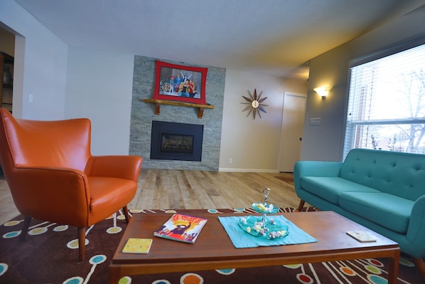 Mid century living room with remote control gas fireplace.

