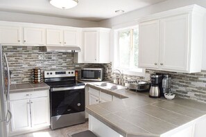 Fully equipped bright and sunny kitchen.