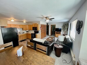 Dining, kitchen, living room, and even hidden washer and dryer. 