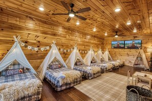 Cabin 2: Lower-level bunk room with teepee beds kids absolutely love