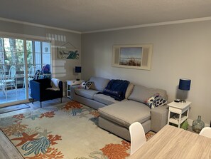 Living room with sliding door to screened porch