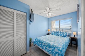 Drift off to sleep in this tranquil master bedroom while listening to the waves.