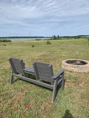 Massive campfire ring. Lots of outside seating to use. Yup you do need bug spray