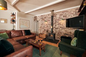 Cosy sitting room with log burner