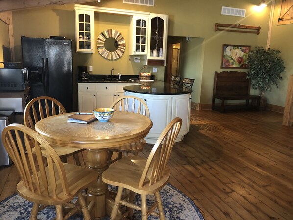 Eating area and kitchen - view to back hall with bedrooms