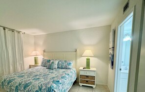 The bedroom has a king bed and  bathroom access.