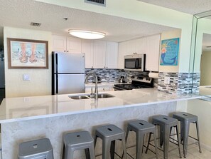 The kitchen bar has plenty of seating.