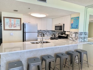 The kitchen bar has plenty of seating.