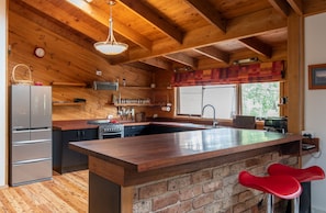 Enormous kitchen and its huge breakfast bar is great for entertaining