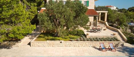 View of the Croatian luxury holiday villa for rent and vacation Hacienda Pag with an outdoor pool on the island of Pag