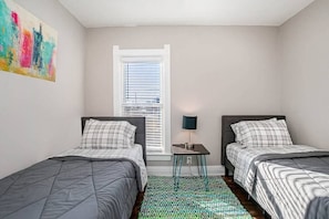 Bedroom 2: Two twin beds.