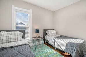 Bedroom 2: Two twin beds.
