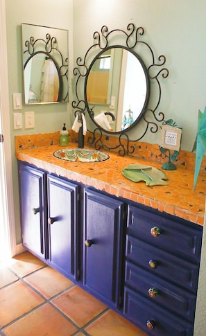 Primary bathroom with handmade mosaic vanity