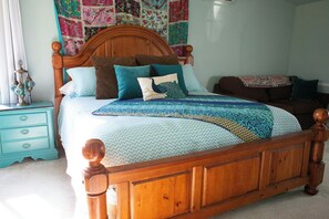 The primary bedroom boasts a King bed and a spacious room with en-suite full bathroom.