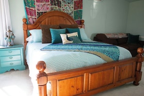 The primary bedroom boasts a King bed and a spacious room with en-suite full bathroom.