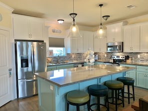 Kitchen and island with seating.