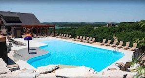 Just across the street is the luxurious outdoor pool with a gorgeous lake view!  Open seasonally during the summer months.