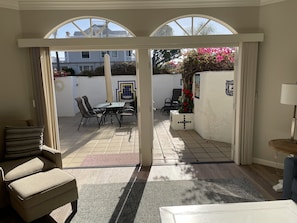 With patio doors open, outdoor patio space connects nicely to indoor space