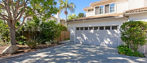 Entry on left side of Garage.  One space open in garage