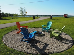 OVERALL: The very cute bonfire ring with Manistee Lake in the background (across the road).