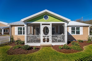 Screened-in front porch with sitting area