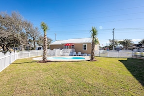 Private in-ground swimming pool with palm trees!