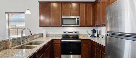 Fully equipped kitchen with stainless steel appliances