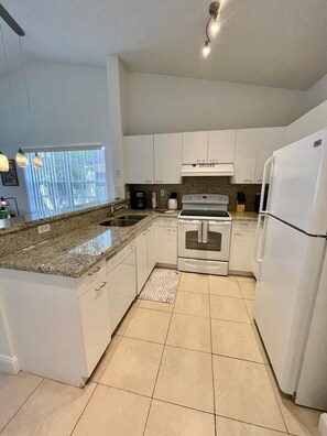 Equipped kitchen with granite counter tops