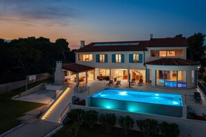 Night view of the luxury seafront villa Sea Whisper for vacation with friends near Šibenik