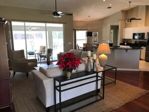 Living room opens out to lanai with spa plunge pool 