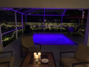 Heated spa plunge pool at night, with jets and LED lights