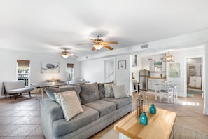 The downstairs living room flooded with natural light